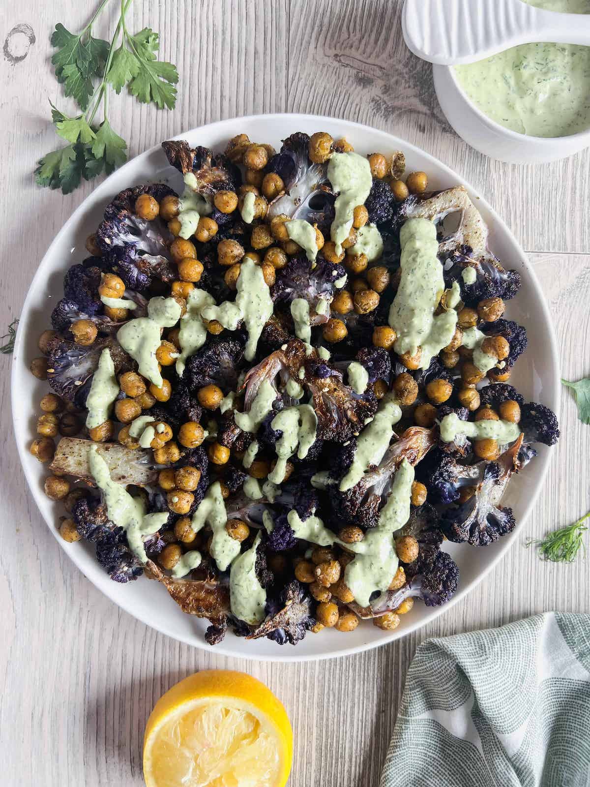 Roasted Purple Cauliflower with Crispy Chickpeas and Lemon Herb Tahini